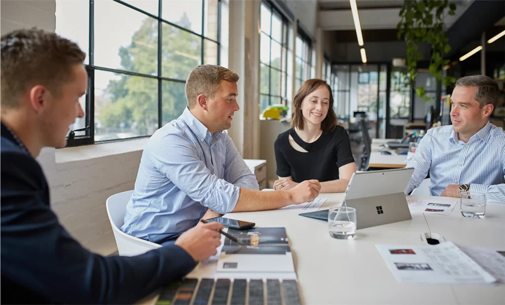 Group of architects discussing plans in office environment corporate photography regional Victoria office Ballarat.