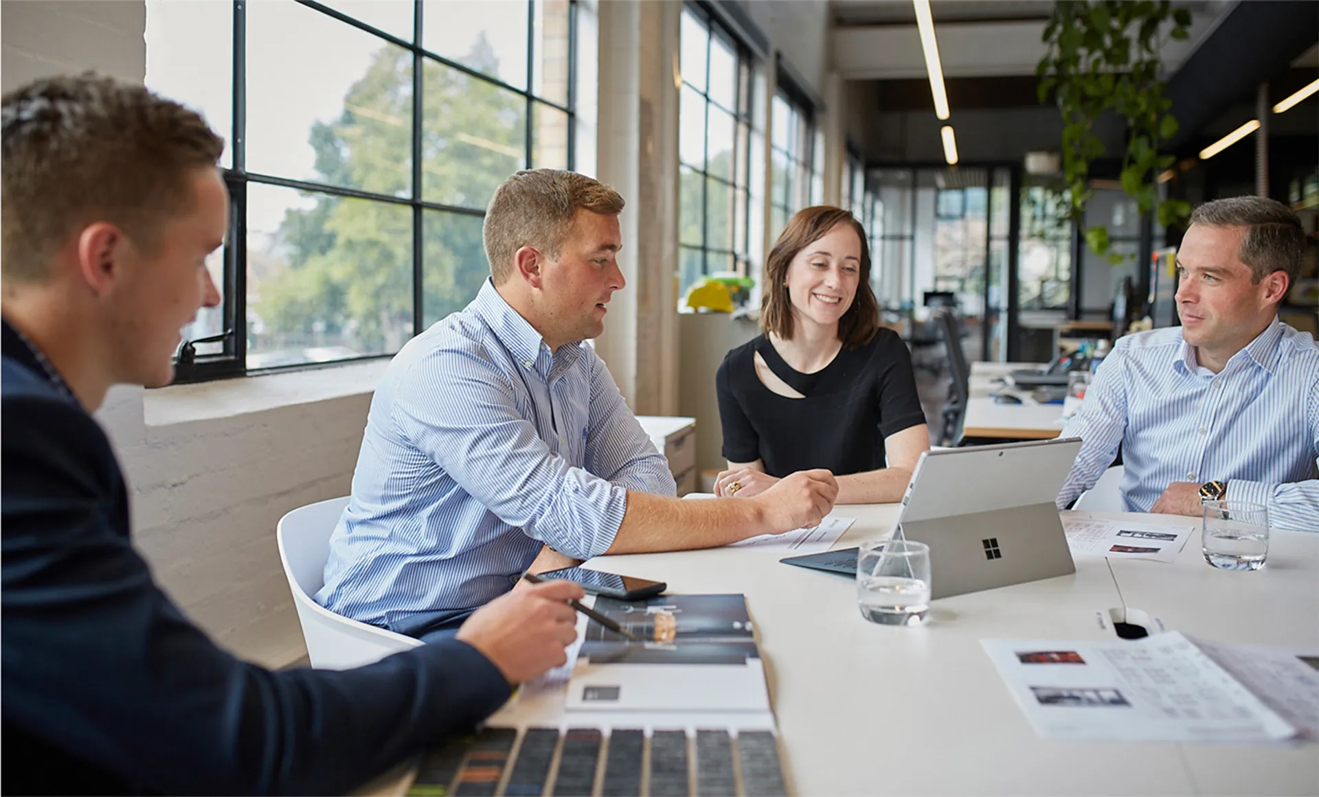 Group of architects discussing plans in office environment corporate photography regional Victoria office Ballarat.